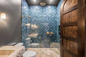 Full bathroom featuring a walk in shower and vanity