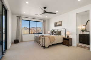 Bedroom featuring light colored carpet, ceiling fan, access to outside, recessed lighting, and connected bathroom