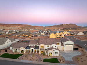 Aerial view at dusk of a residential view and a mountain view