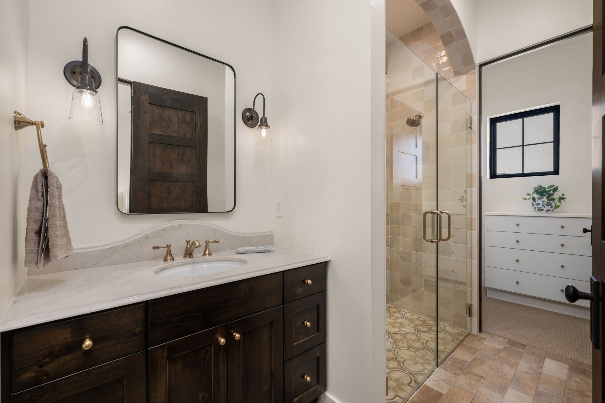 Bathroom with vanity and a stall shower
