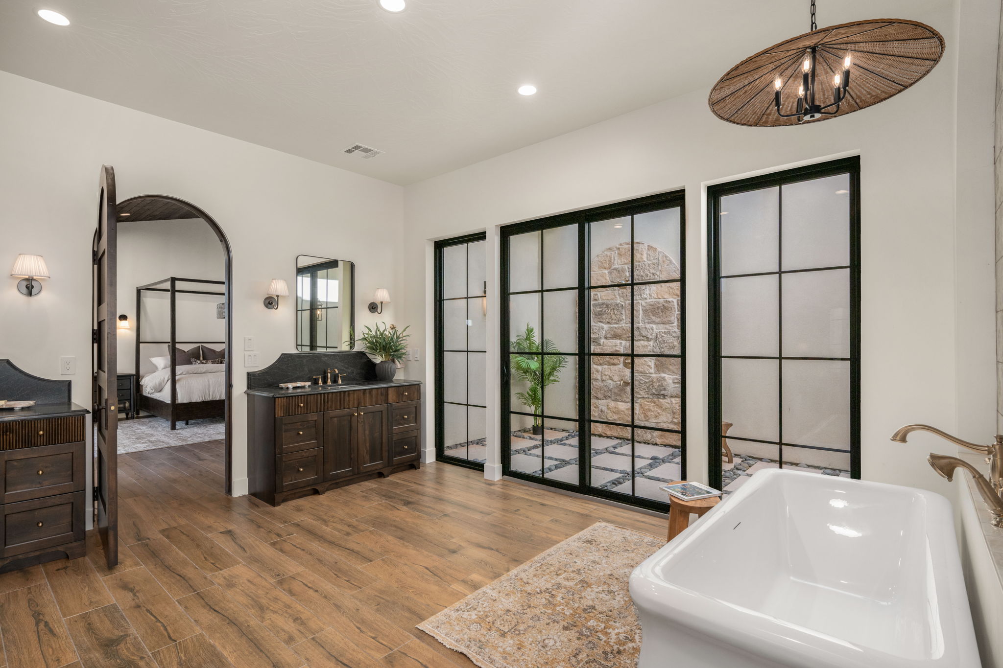 Ensuite bathroom featuring vanity, dark wood-style floors, a tub to relax in, and recessed lighting