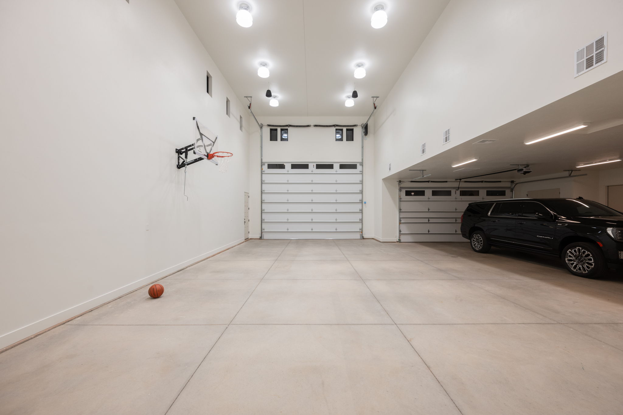 Garage featuring baseboards