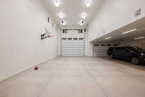 Garage featuring baseboards