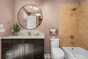Bathroom featuring vanity and shower / bath combination