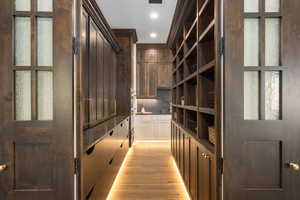 Mudroom with light wood-style flooring and recessed lighting
