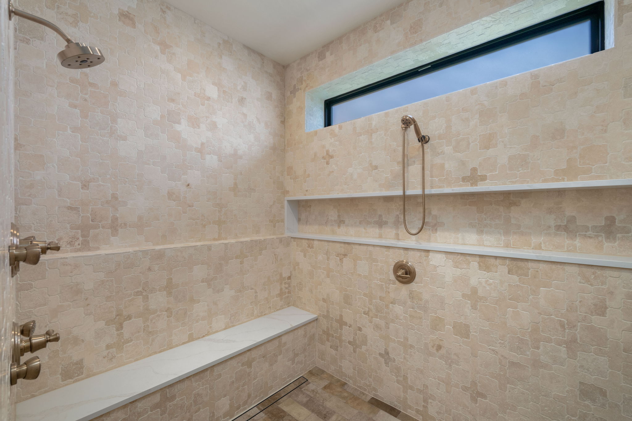 Full bathroom with a tile shower
