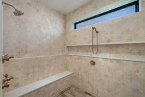 Full bathroom with a tile shower