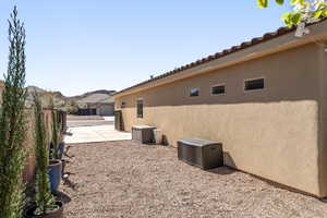 View of side of home featuring stucco siding