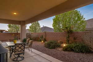 Fenced backyard with outdoor dining area and a patio area