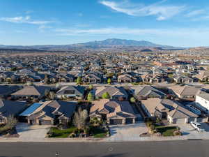 Aerial perspective of suburban area with a mountain backdrop