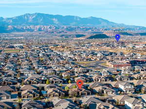 View of property location with a mountainous background and nearby suburban area