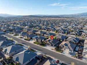Aerial perspective of suburban area featuring a mountain backdrop