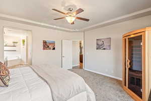 Bedroom with a sauna / steam room, light carpet, and a ceiling fan