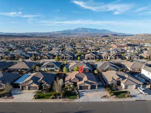Aerial perspective of suburban area with a mountainous background