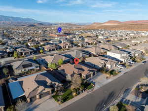 Aerial perspective of suburban area with a mountain backdrop