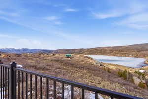 View of Witt's Lake with mountains with views of Mayflower and Deer Valley Ski Resort runs