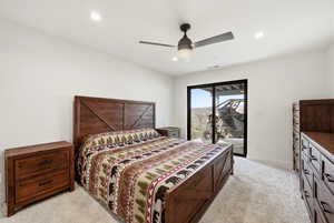 Bedroom with access to exterior, light colored carpet, a ceiling fan, and recessed lighting