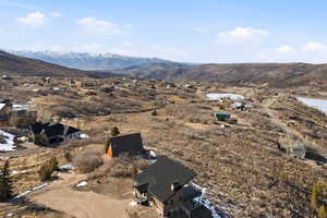 Aerial view of residential area with mountains and ski runs