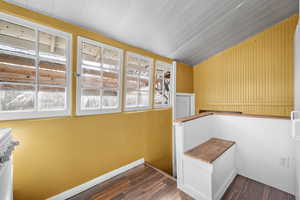 Staircase featuring wood finished floors