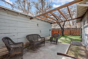 Fenced backyard with a patio area and a pergola