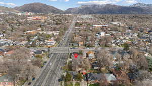 View of property location featuring nearby suburban area and mountains