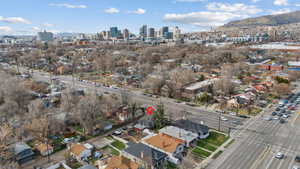 Aerial view of property's location featuring city skyline and mountains