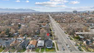 Aerial perspective of suburban area featuring a mountainous background
