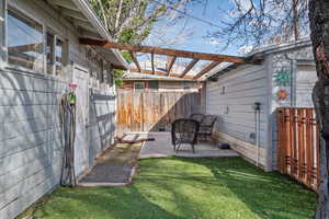 Fenced backyard with a patio area