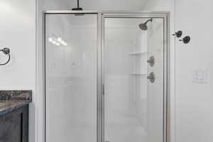 Primary bath with vanity and a stall shower