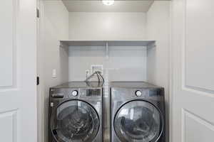 Laundry area featuring a separate washer and dryer.
