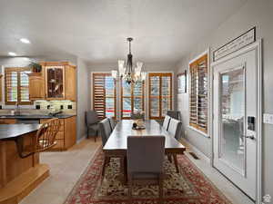 Dining room featuring suspended lighting.