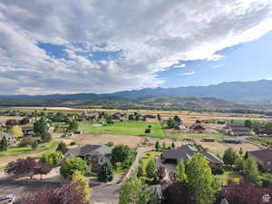 Aerial view of residential area featuring a mountainous background