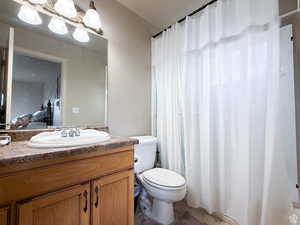 Second floor, Ensuite bathroom featuring vanity, light tile patterned floors, and a shower with curtain
