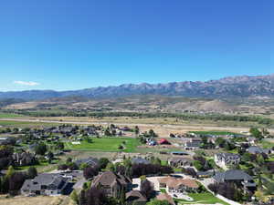 Aerial view of residential area with a mountainous background