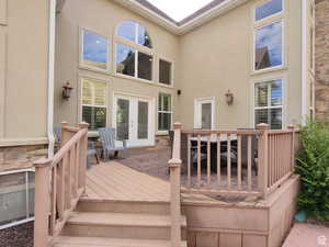 Deck featuring french doors and outdoor dining area