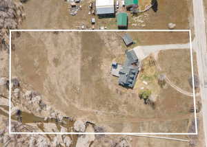 Aerial view of property and surrounding area featuring property boundaries highlighted