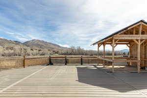 Wooden terrace featuring a mountain view