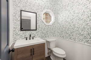 First floor half bath right between mudroom and kitchen.