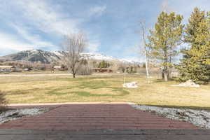 View of grassy yard featuring a Mountain View of the North Ogden Divide and Ben Lomond