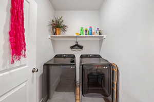 Laundry area with washer and clothes dryer