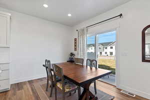 Dining space featuring light wood-style flooring and recessed lighting