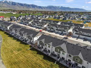 Aerial view of residential area featuring a mountain backdrop