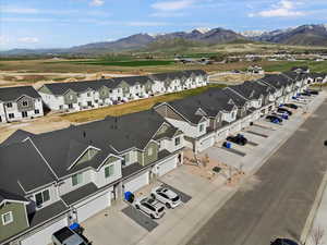 Aerial view of residential area featuring a mountainous background