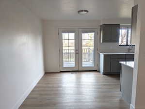 Entryway with french doors and wood finished floors