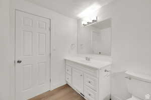 Bathroom with vanity and light wood-type flooring