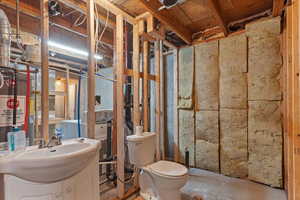 Bathroom with vanity and gas water heater