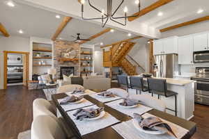 An open, flowing floorplan makes this a great home to gather in.  Wood beamed ceiling and accents with a modern touch!