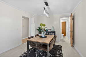 Dining room featuring ornamental molding and baseboards