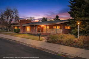 Inviting front porch and a stately chimney that hints at the warmth inside. A spacious yard and clean lines offer curb appeal in a coveted neighborhood.