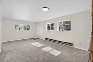 Flex-space featuring plenty of natural light, neutral carpeting, baseboard heating, and a private entry. Possible ADU conversion, rental income, or a guest wing (buyer to verify city requirements).